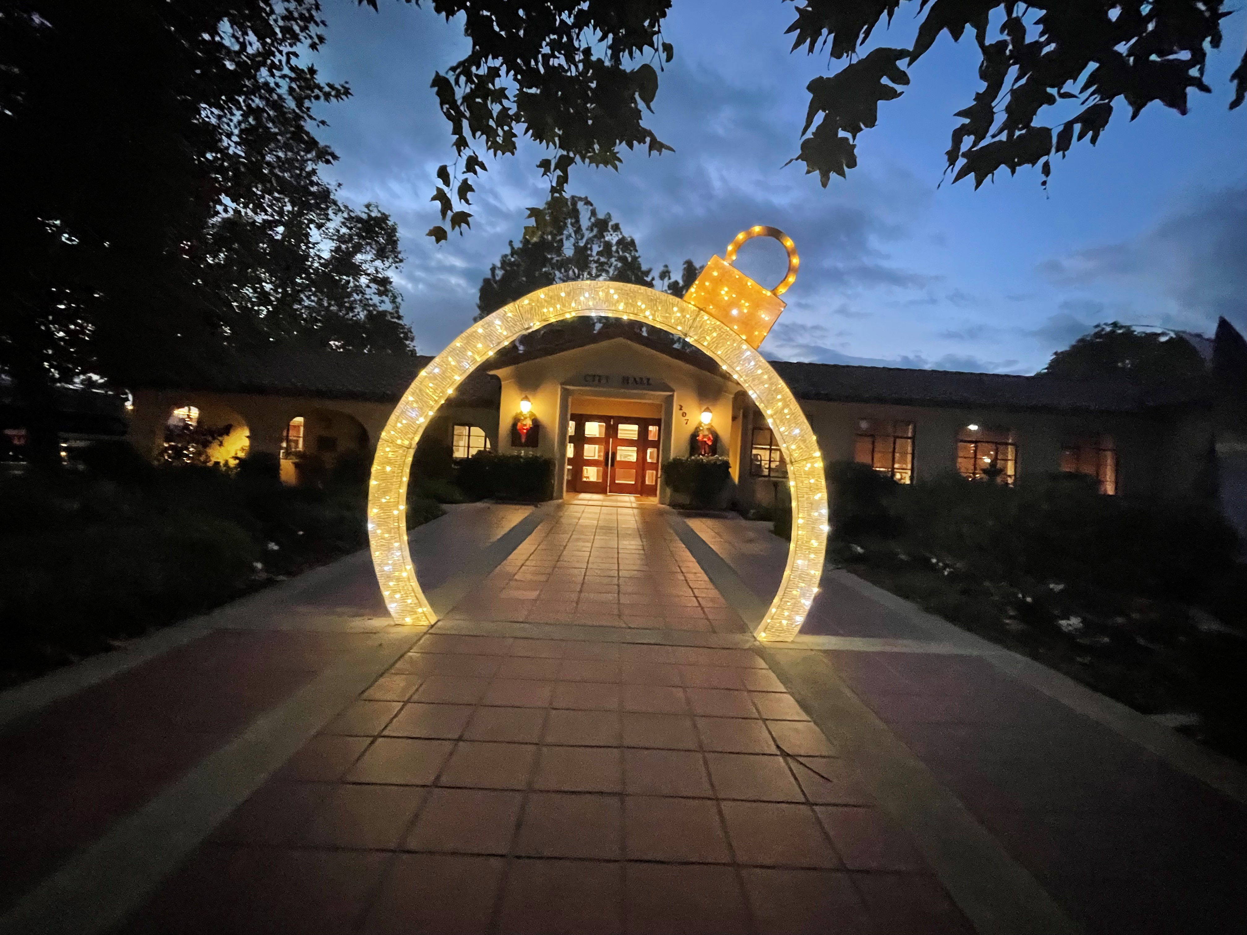 city hall at night with holiday lights